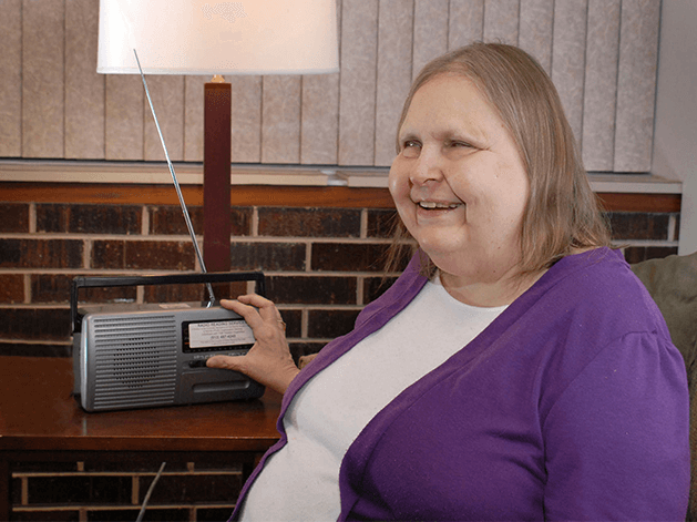 woman listening to broadcast radio