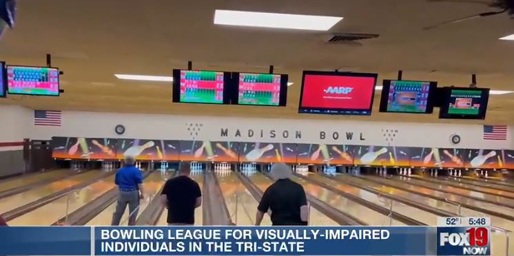 Snippet of Fox19 interview shows Madison Bowl lanes with three people bowling. 