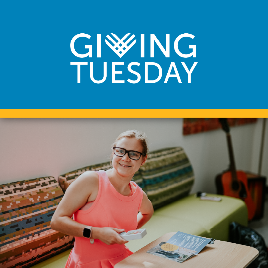 Young lady in a pink dress using a low vision aid