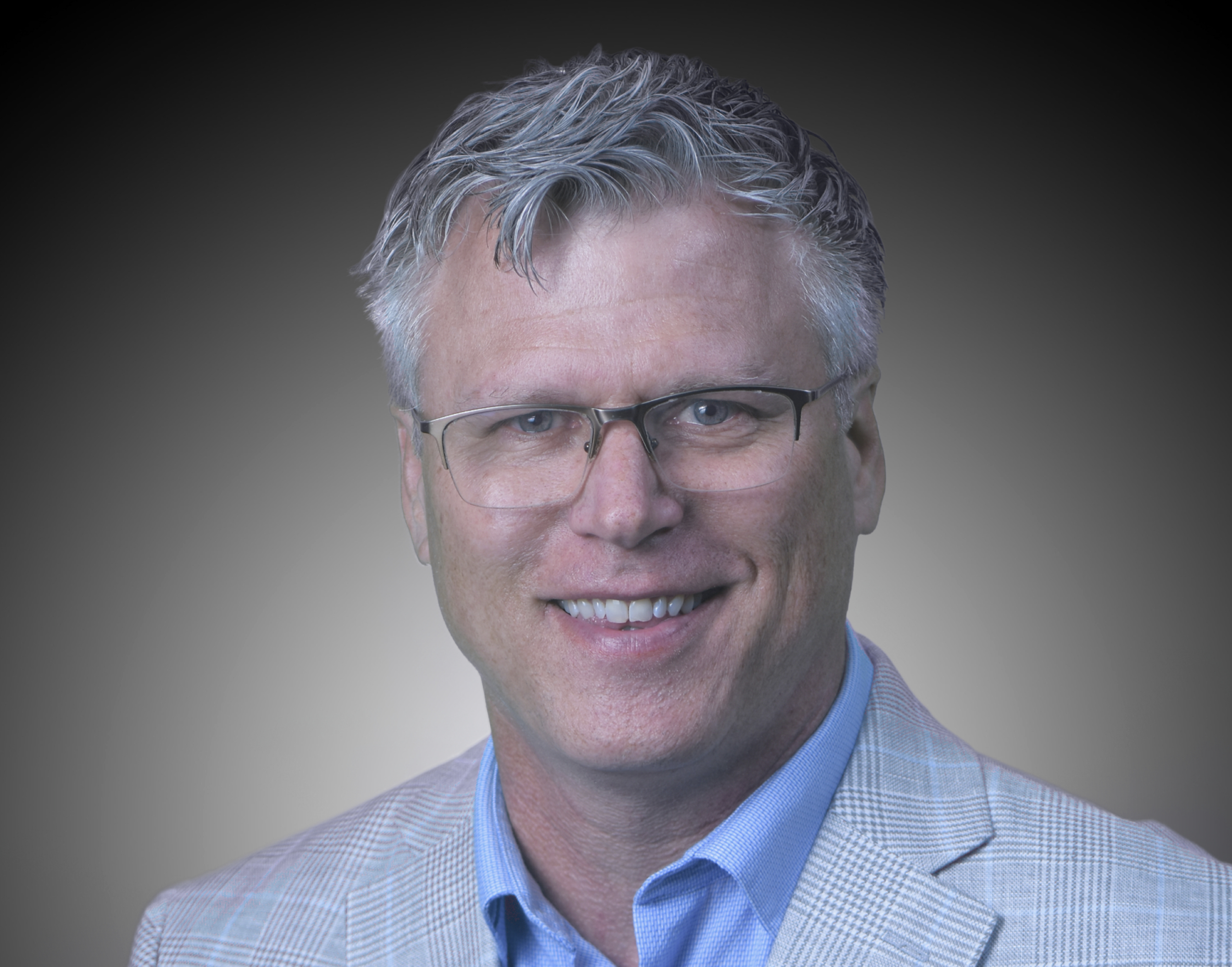 Man wearing a suit and glasses