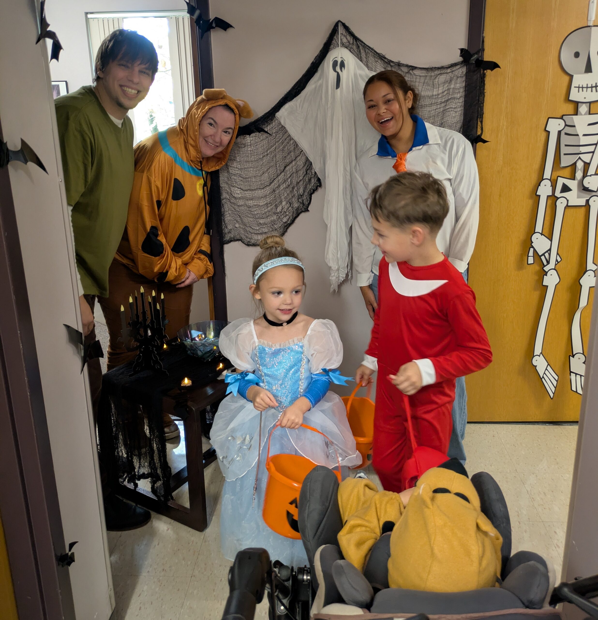 Children and adults dressed up for Halloween